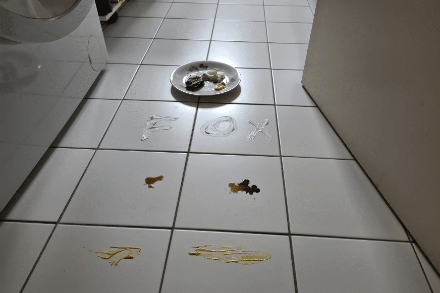 Artificially creating stains on the floor for testing the Roborock S7 Pro Ultra's mopping function.