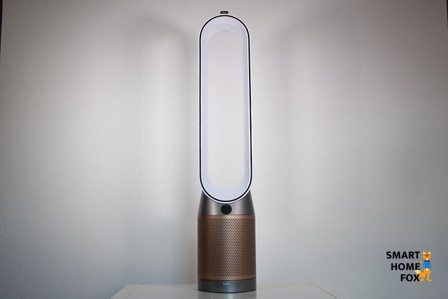 The Dyson Purifier Cool Formaldehyde TP09 air purifier and tower fan stands on a shelf in front of a white wall.