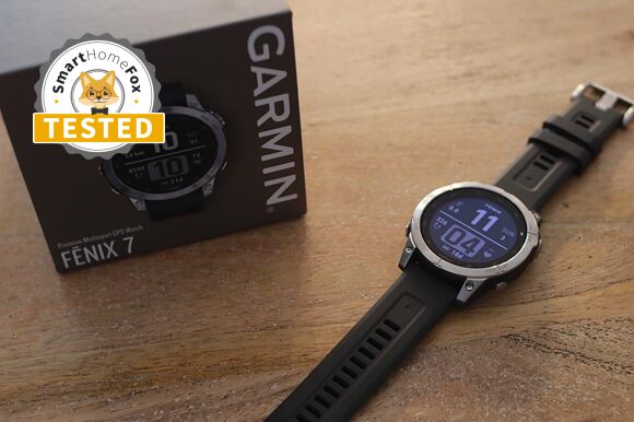 You can see the Garmin Fenix 7 lying on the table next to its box.