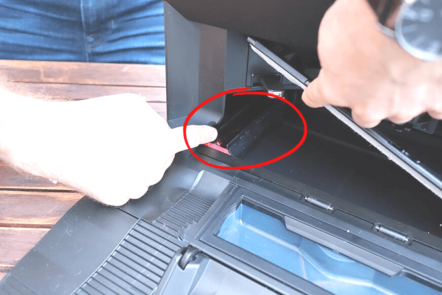 A finger points to the Roborock S7 MaxV Ultra Station's mop cleaning brush.