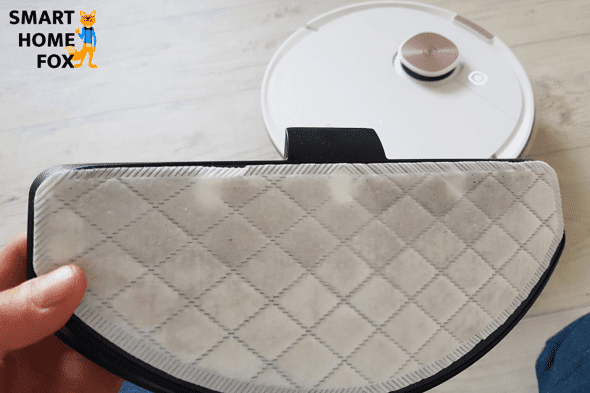 Holding the dirty mop of the Ecovacs Deebot T8+ into the camera.