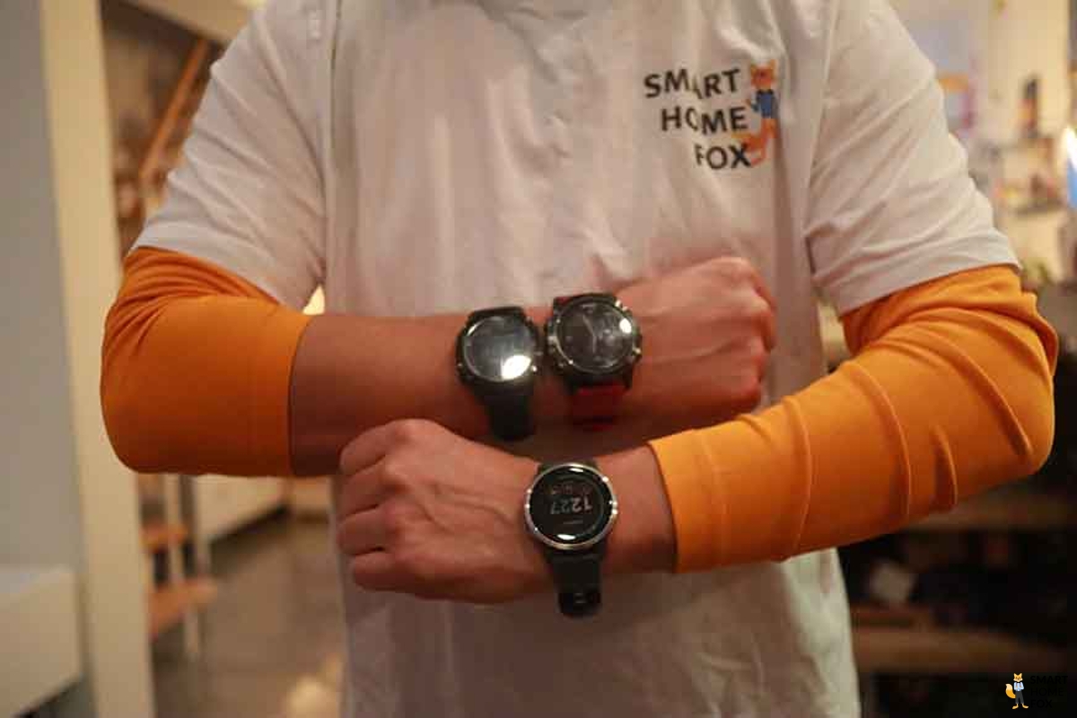 You can see various smartwatches and sports watches being worn on an arm.
