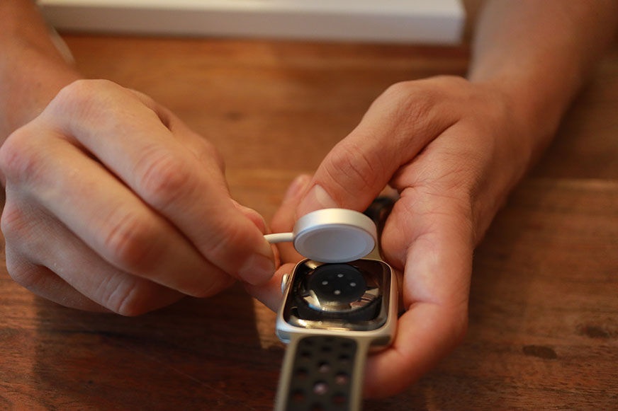 A smartwatch is seen charging