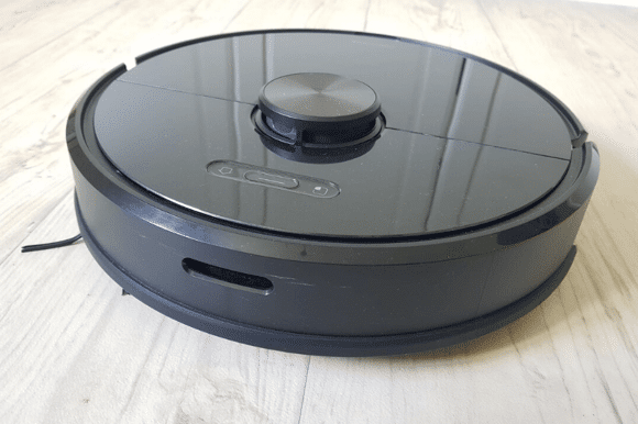 The Roborock S6 robot vacuum stands on the floor